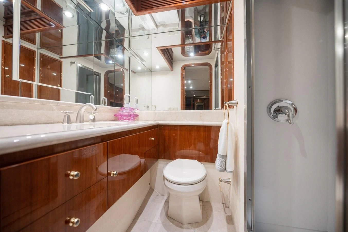 a bathroom with a sink toilet and a mirror aboard DOLCE VITA Yacht for Sale