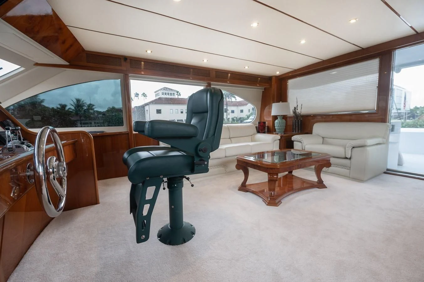a living room with a couch and a coffee table aboard DOLCE VITA Yacht for Sale