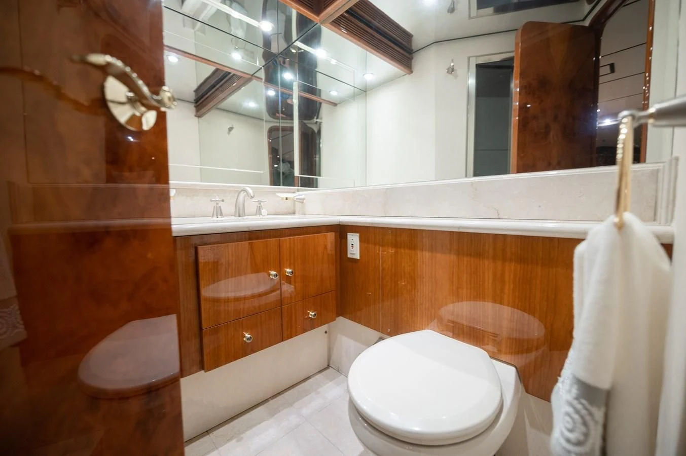 a bathroom with a toilet and sink aboard DOLCE VITA Yacht for Sale