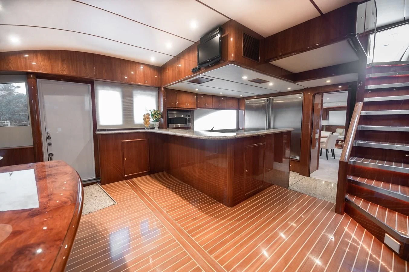 a large kitchen with wooden floors aboard DOLCE VITA Yacht for Sale