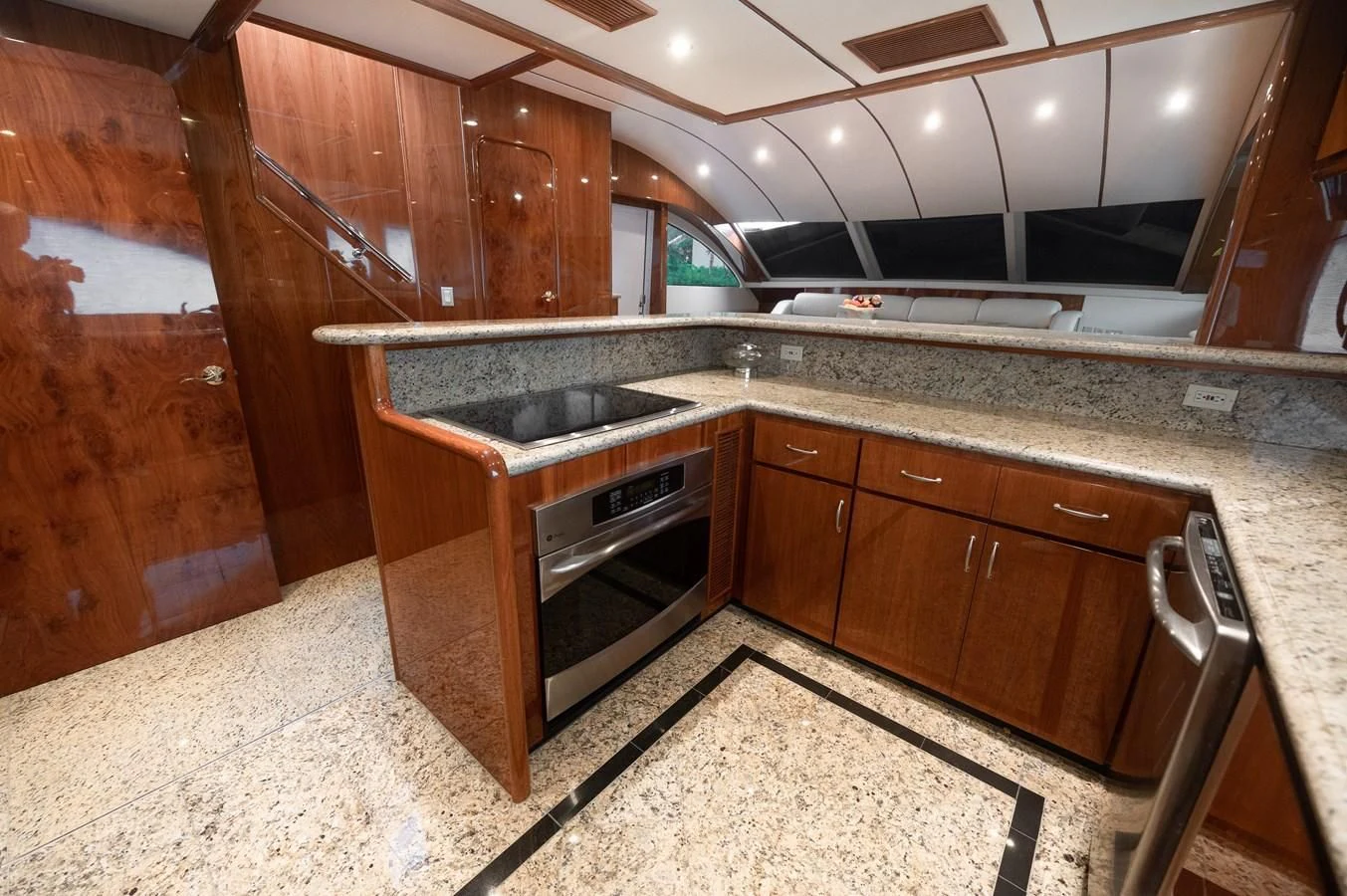 a kitchen with wooden cabinets aboard DOLCE VITA Yacht for Sale