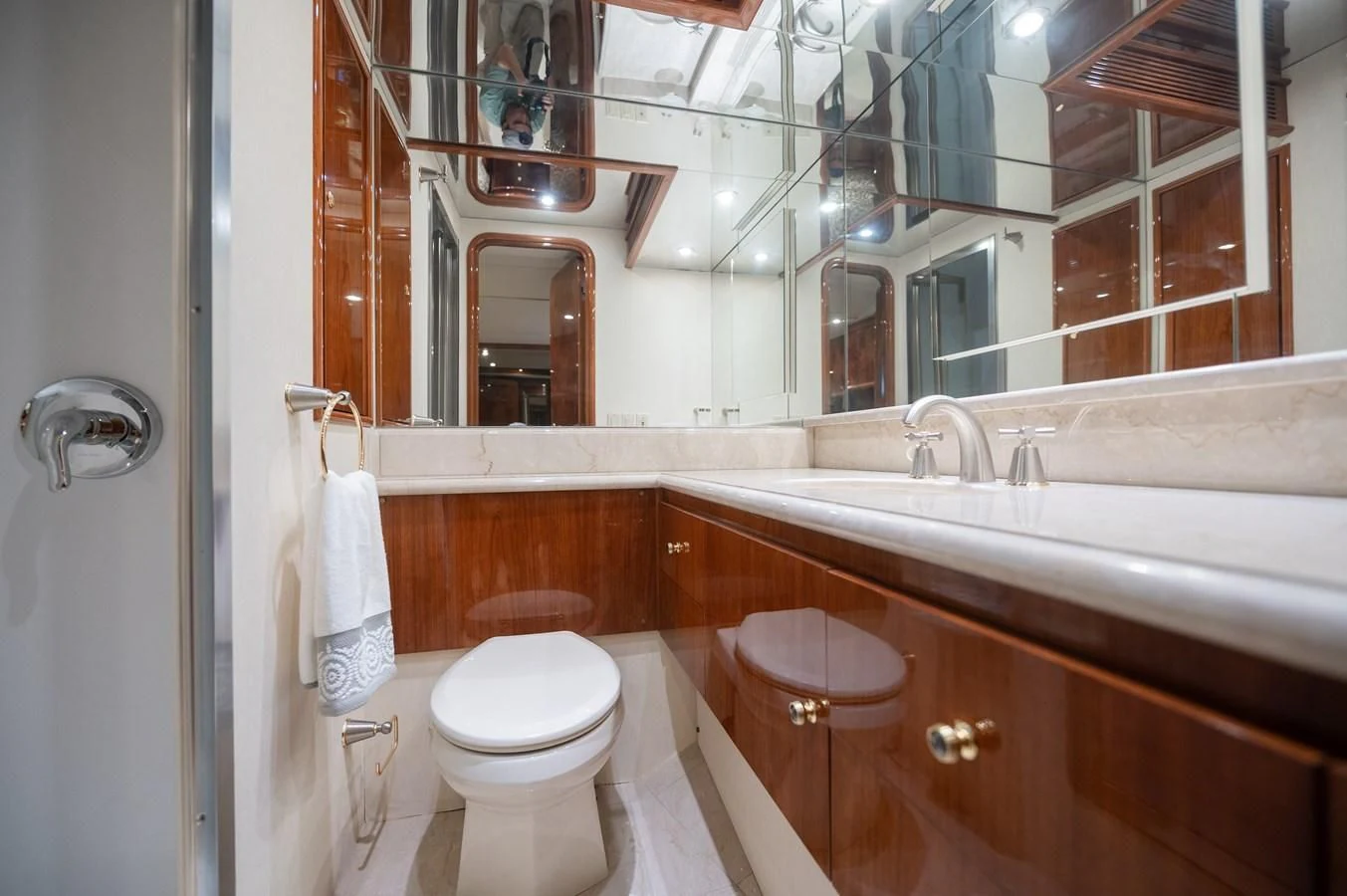 a bathroom with a toilet and a sink aboard DOLCE VITA Yacht for Sale