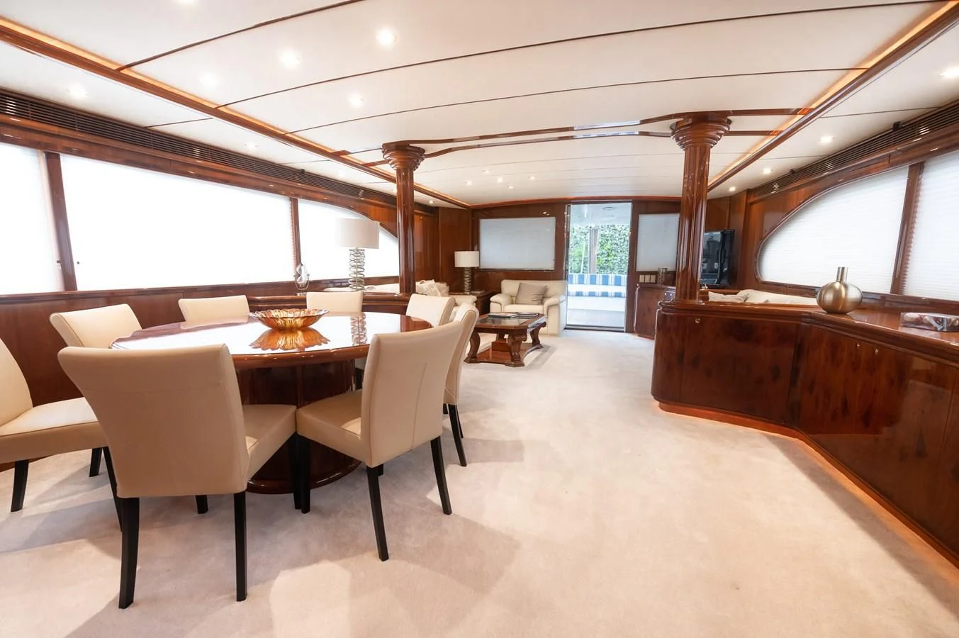 a room with a piano and chairs aboard DOLCE VITA Yacht for Sale