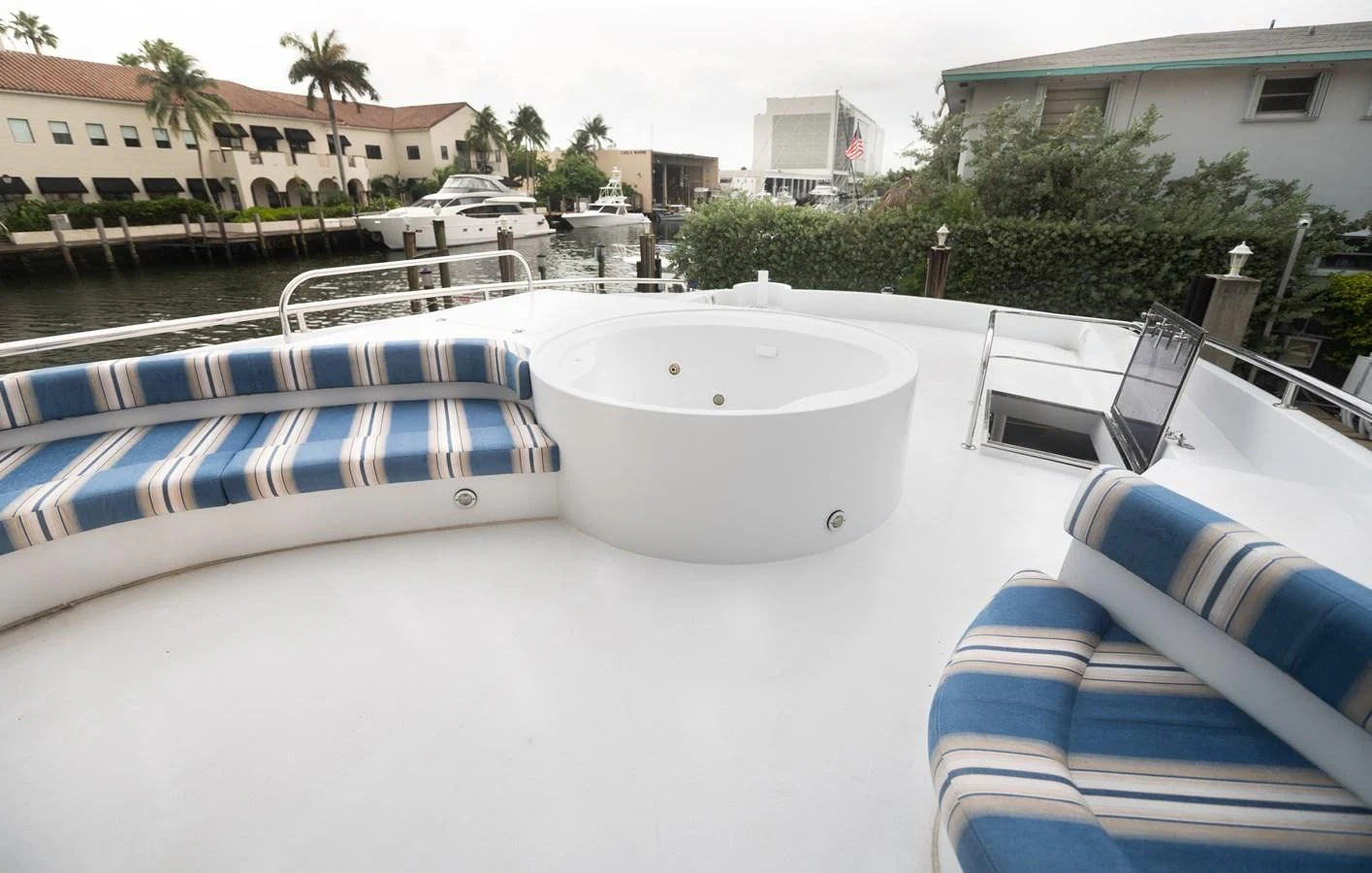 a pool with a chair and a table and chairs aboard DOLCE VITA Yacht for Sale