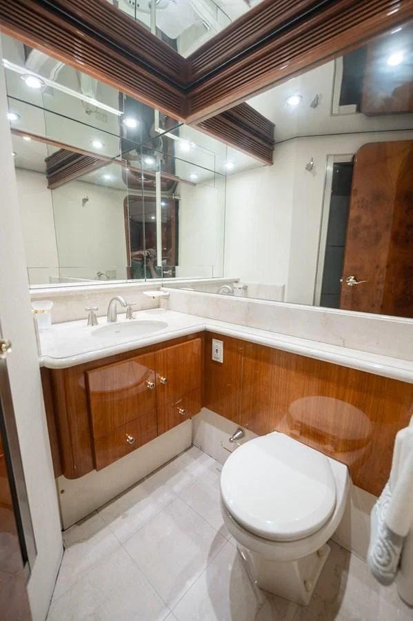 a bathroom with a large mirror aboard DOLCE VITA Yacht for Sale