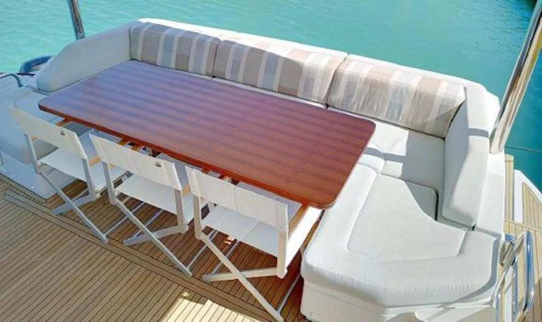 a wooden boat on a deck aboard NOMAD Yacht for Sale
