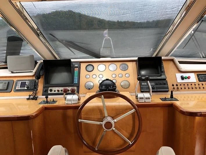 a wooden desk with a radio and radio aboard BLUE DOLPHIN Yacht for Sale