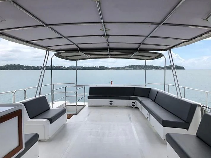 a large lounge area on a boat aboard BLUE DOLPHIN Yacht for Sale