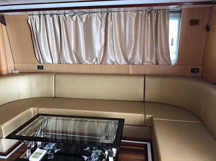 a room with a table and a window aboard BLUE DOLPHIN Yacht for Sale