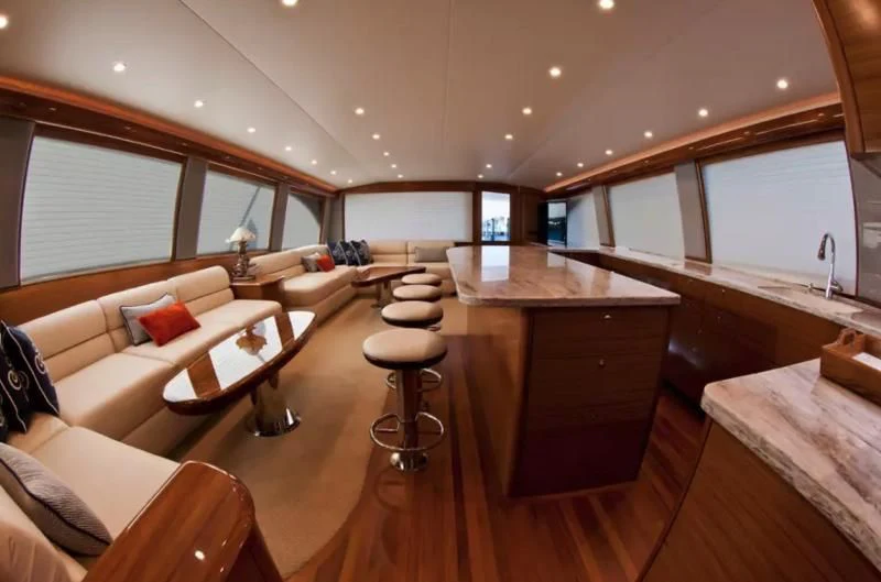 a living room with a wood floor aboard ISLAMAR Yacht for Sale