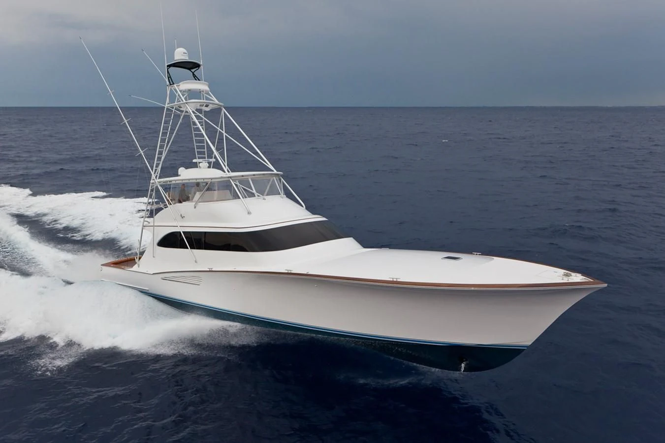a white boat on the water aboard ISLAMAR Yacht for Sale