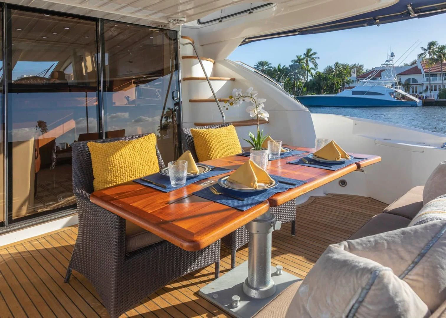 a table with chairs on it aboard UNFORGETTABLE Yacht for Sale