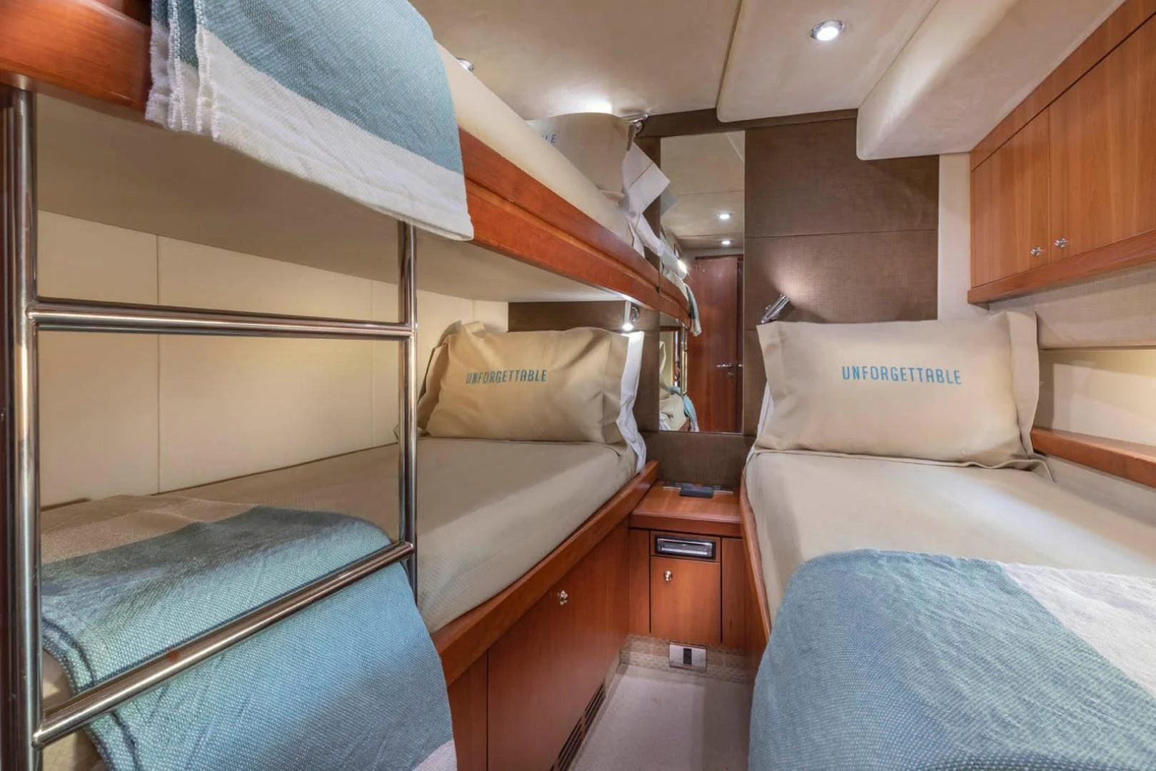 a bed with a couple of beds aboard UNFORGETTABLE Yacht for Sale
