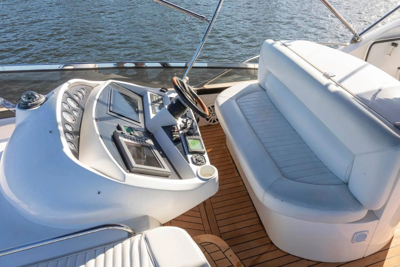 a boat with a steering wheel aboard UNFORGETTABLE Yacht for Sale