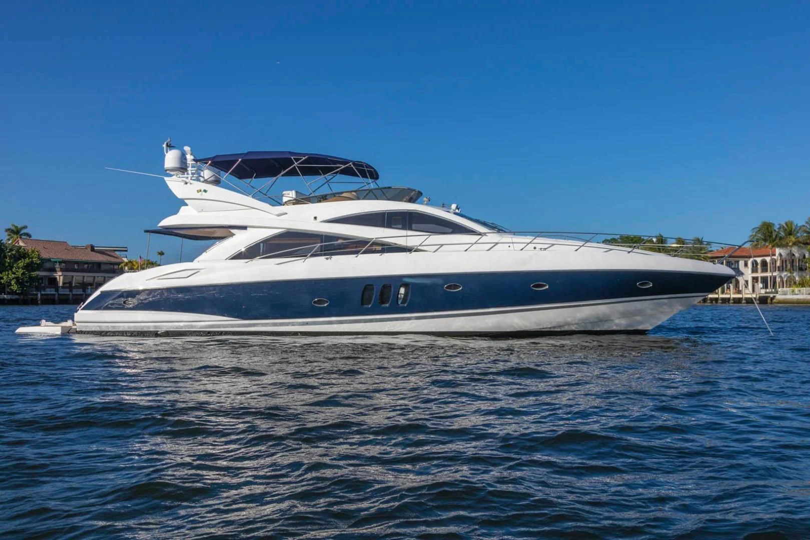 a white yacht on the water aboard UNFORGETTABLE Yacht for Sale