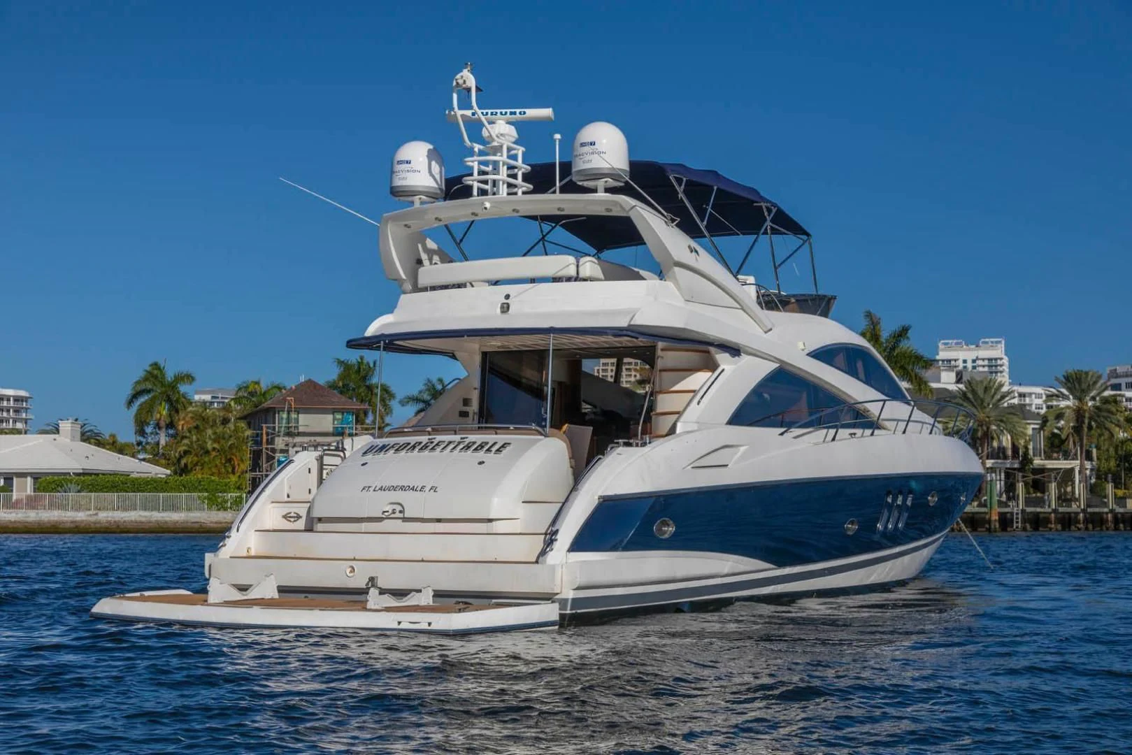 a white boat on the water aboard UNFORGETTABLE Yacht for Sale