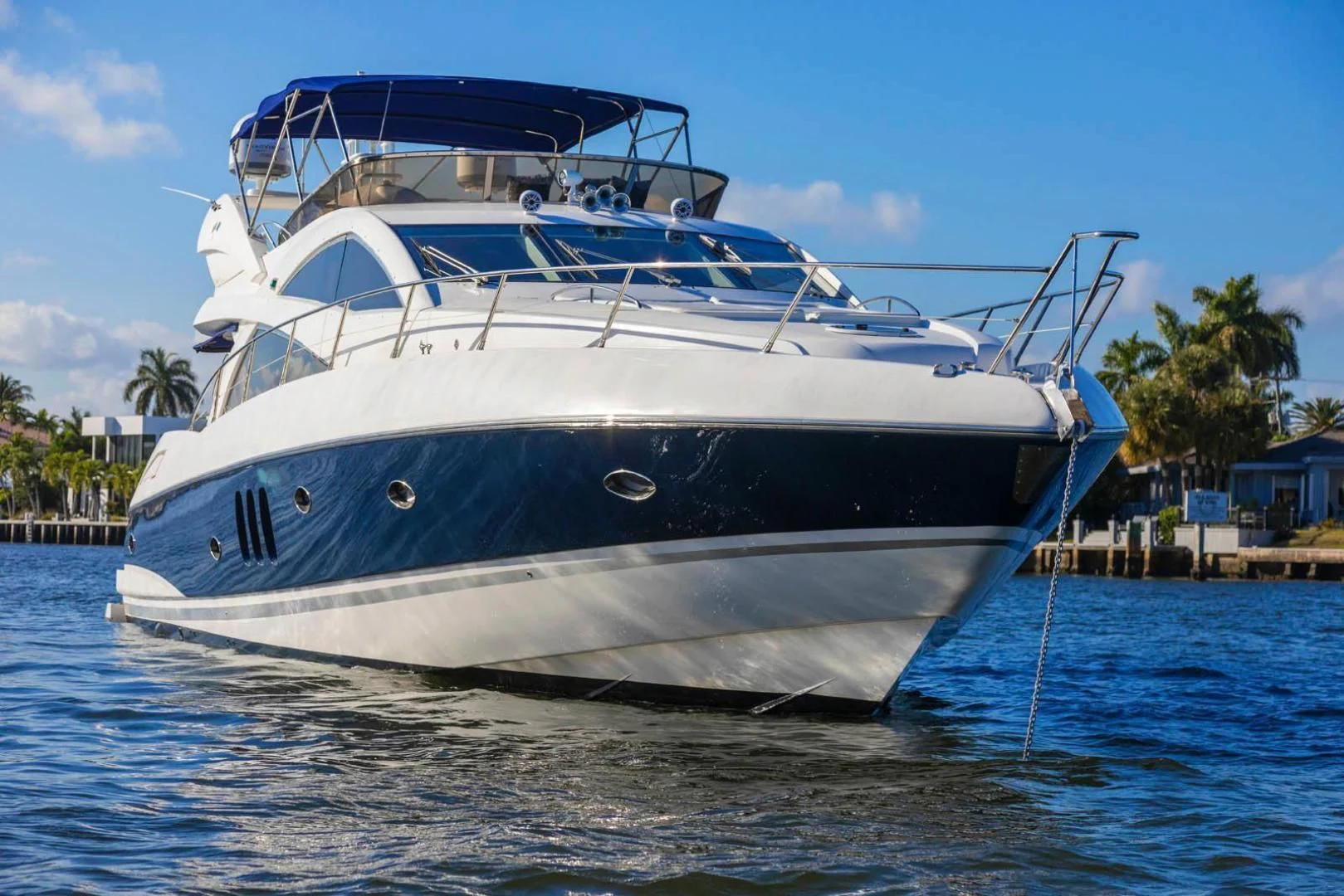 a large white boat in the water aboard UNFORGETTABLE Yacht for Sale