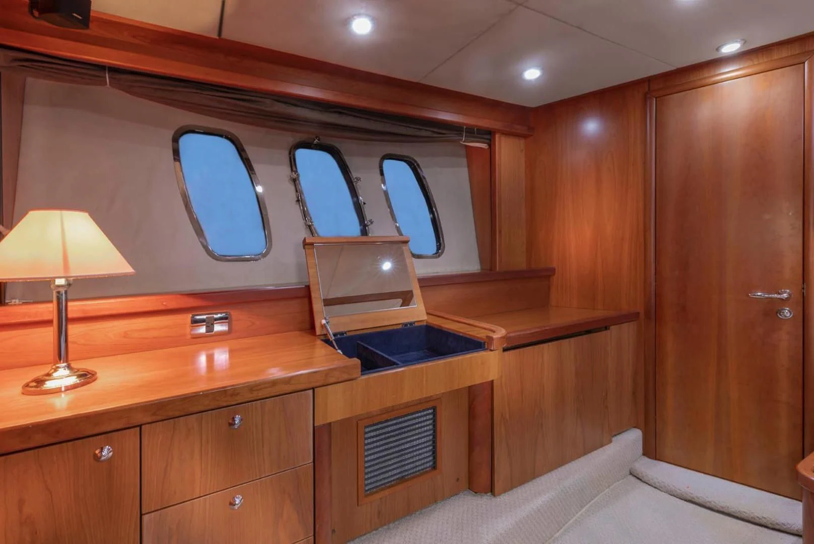 a cabin with a bed and a desk aboard UNFORGETTABLE Yacht for Sale