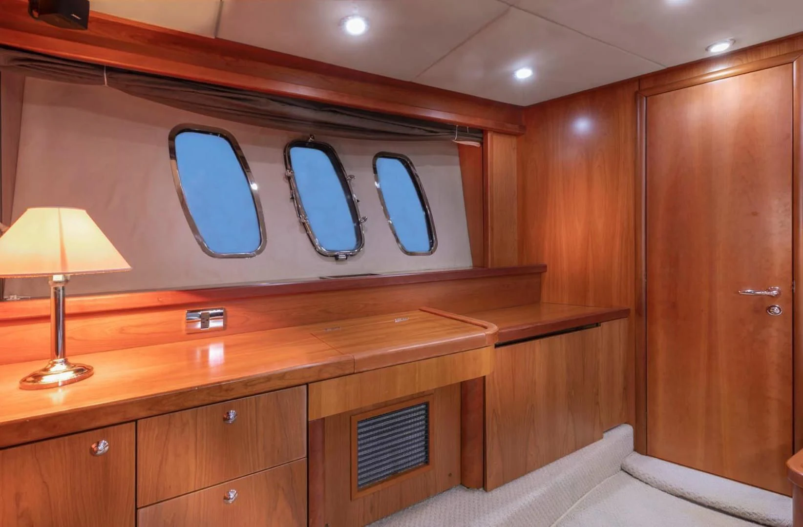 a room with a desk and a bed aboard UNFORGETTABLE Yacht for Sale