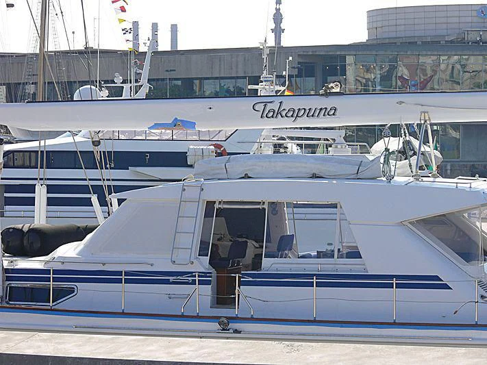 a boat parked in a harbor aboard TAKAPUNA Yacht for Sale