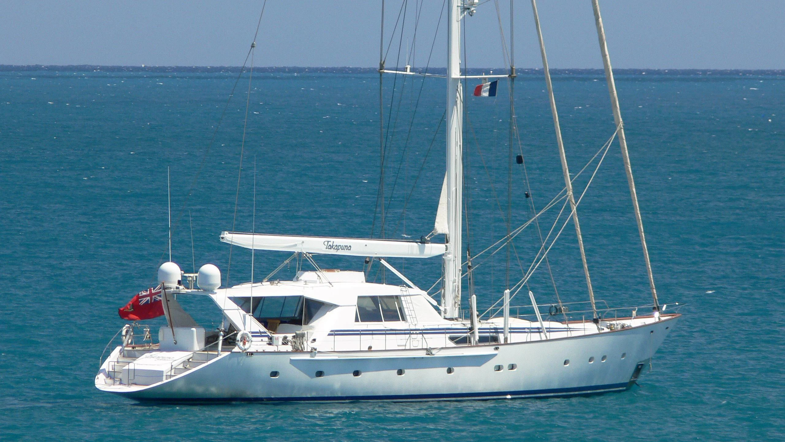 a white boat in the water aboard TAKAPUNA Yacht for Sale