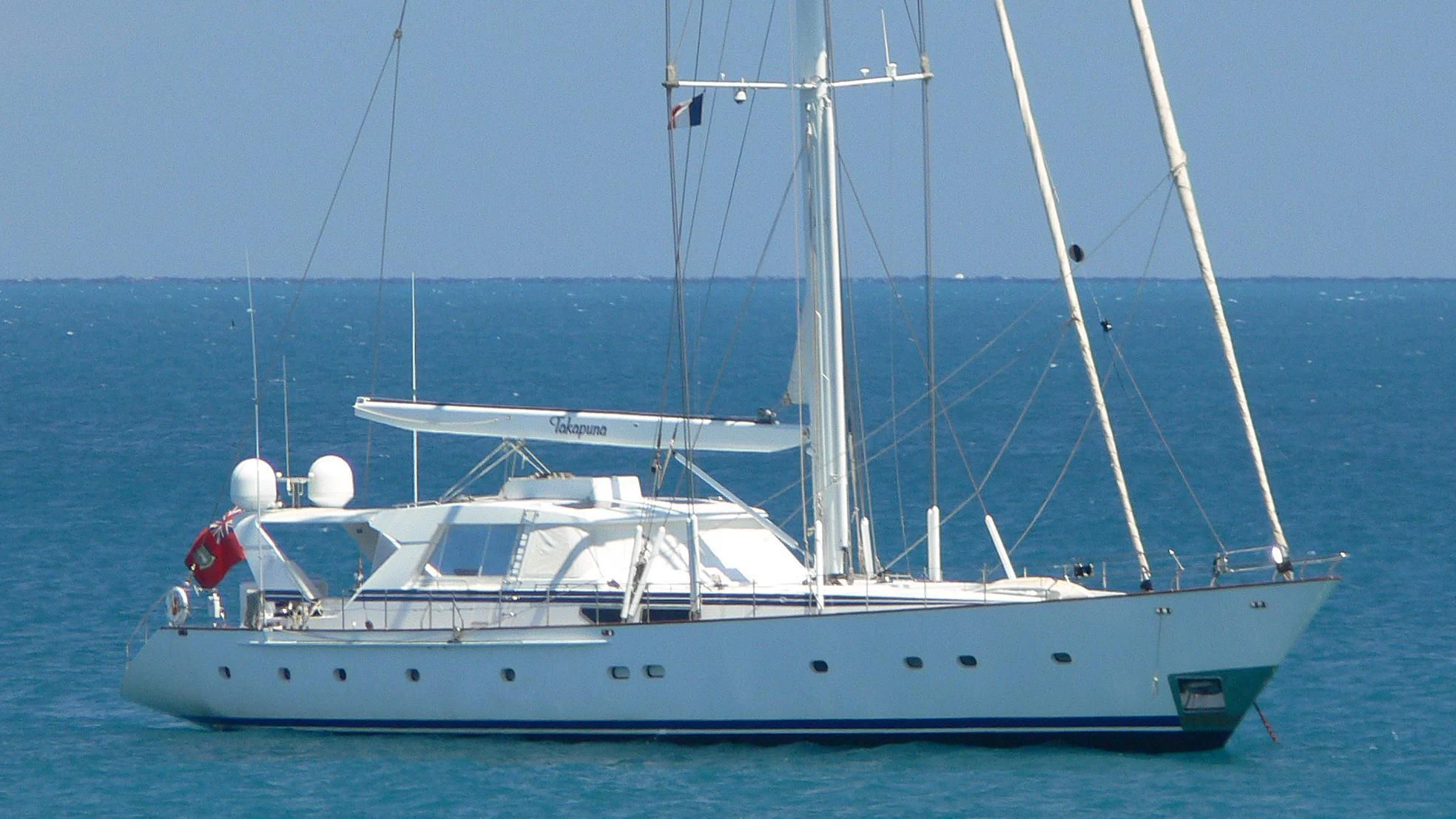 a white boat in the water aboard TAKAPUNA Yacht for Sale