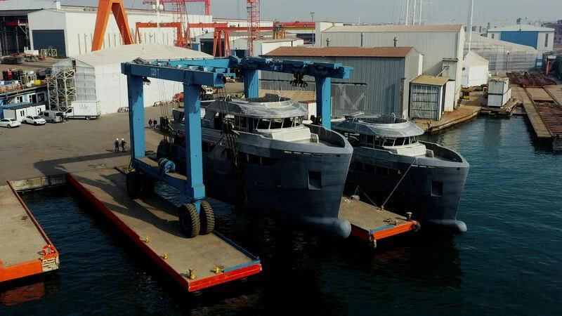 a large boat docked at a port aboard BERING 80/01 Yacht for Sale