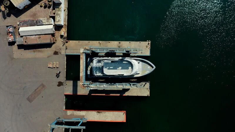 a group of boxes and a plate on a table aboard BERING 80/01 Yacht for Sale