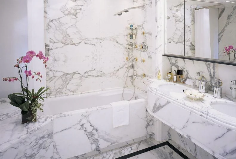 a bathroom with a tub sink and a sink aboard QUEEN MIRI Yacht for Sale