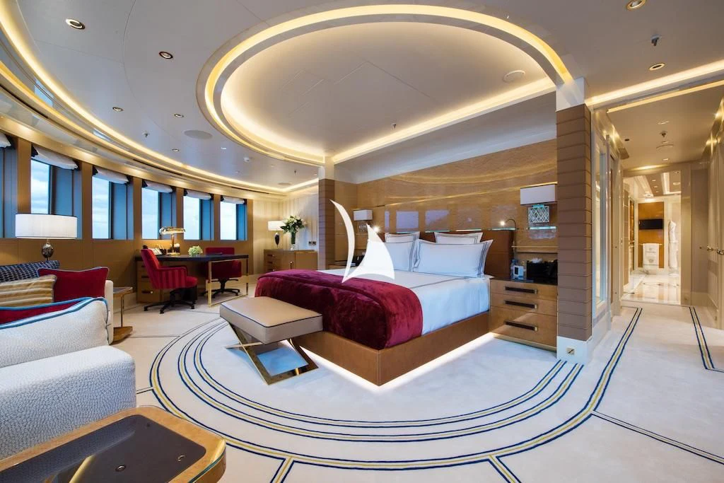 a room with a bed and a couch aboard QUEEN MIRI Yacht for Sale