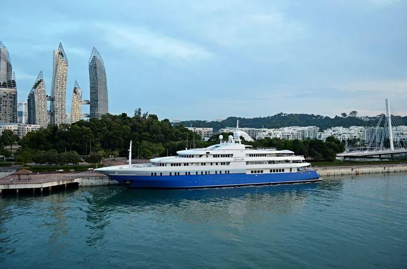 a large boat in the water aboard QUEEN MIRI Yacht for Sale