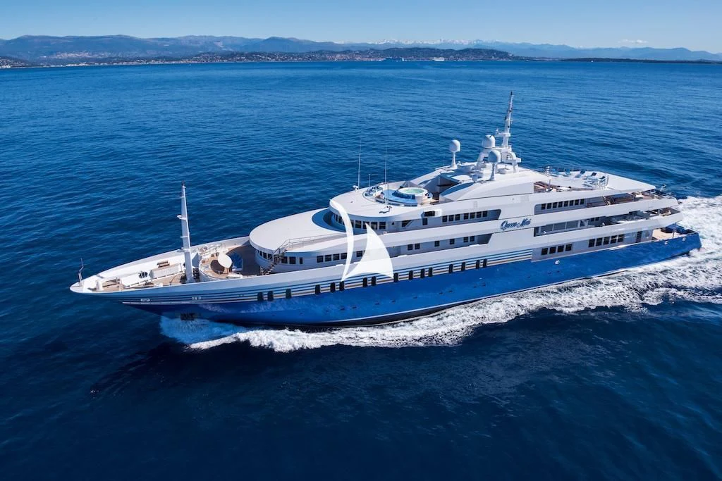 a large white ship in the water aboard QUEEN MIRI Yacht for Sale