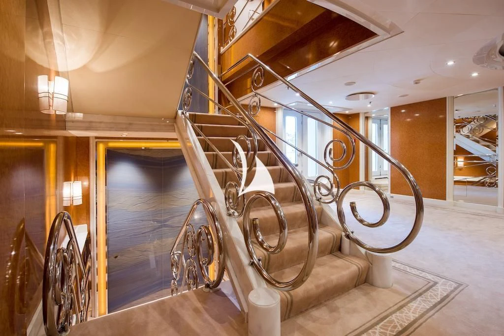 a staircase inside a building aboard QUEEN MIRI Yacht for Sale