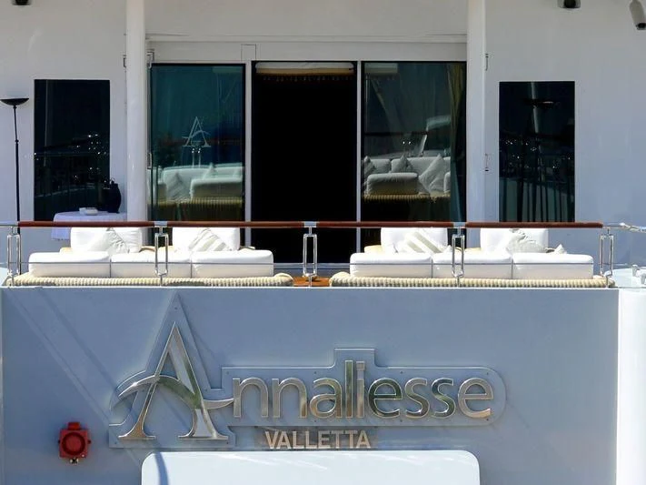 a large blue and white building with a balcony aboard QUEEN MIRI Yacht for Sale