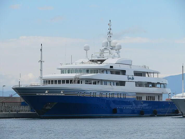 a large white and blue boat aboard QUEEN MIRI Yacht for Sale