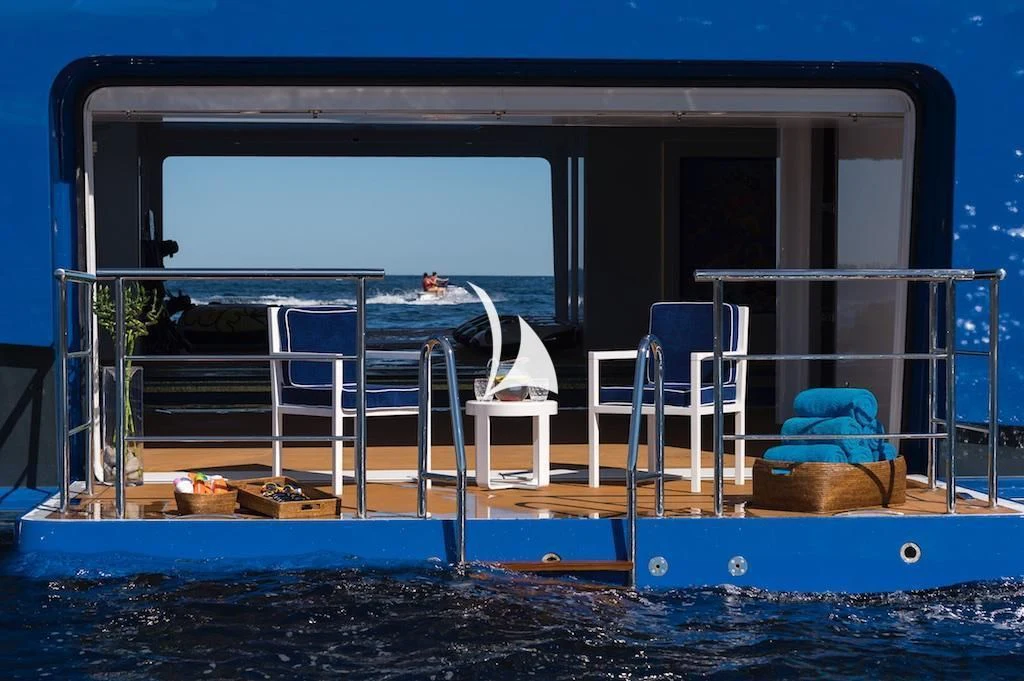 a deck with a chair and a chair on it aboard QUEEN MIRI Yacht for Sale