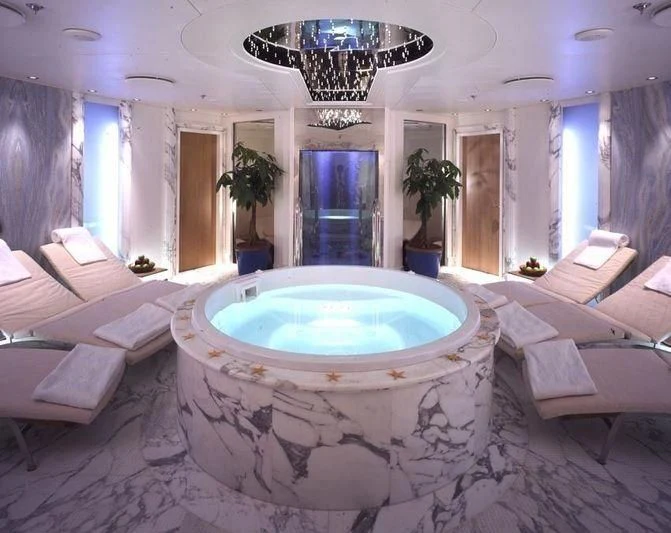 a large jacuzzi in a bathroom aboard QUEEN MIRI Yacht for Sale