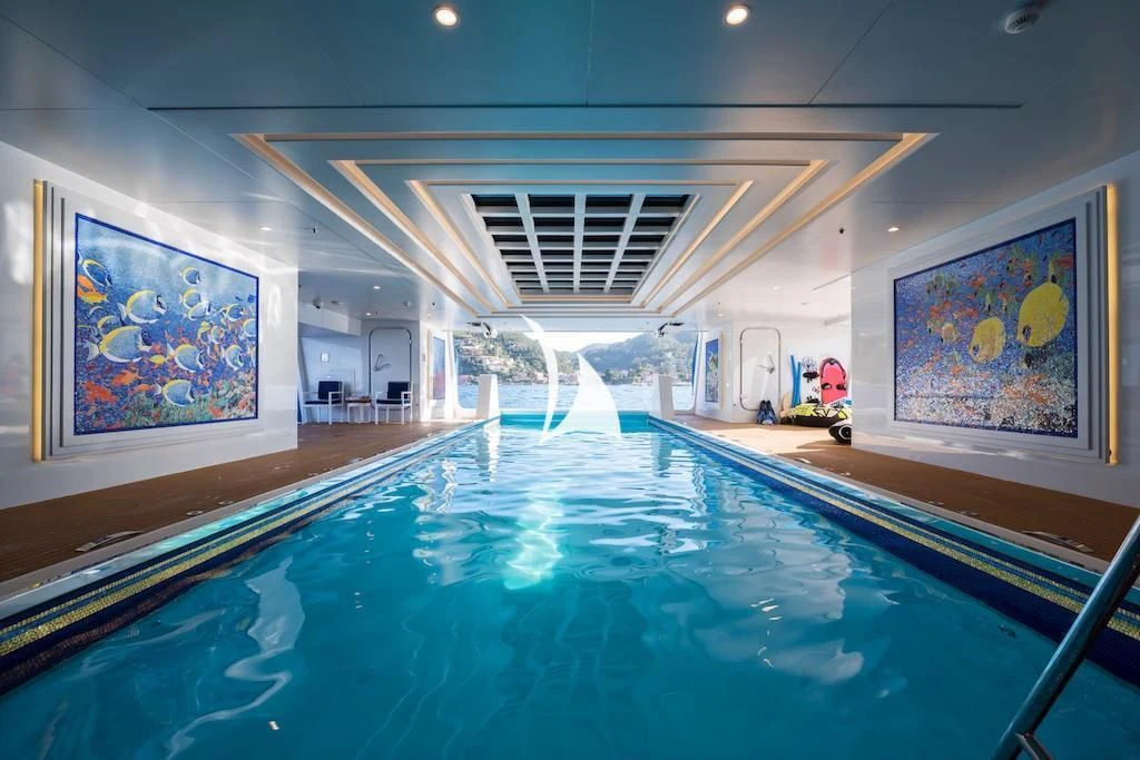 a swimming pool in a building aboard QUEEN MIRI Yacht for Sale