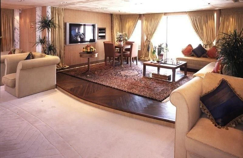 a living room with a large screen aboard QUEEN MIRI Yacht for Sale
