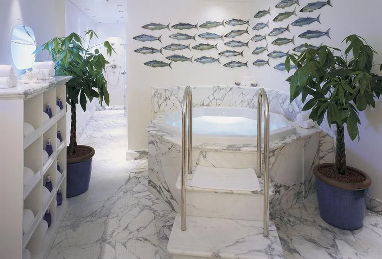 a white chair in a room aboard QUEEN MIRI Yacht for Sale