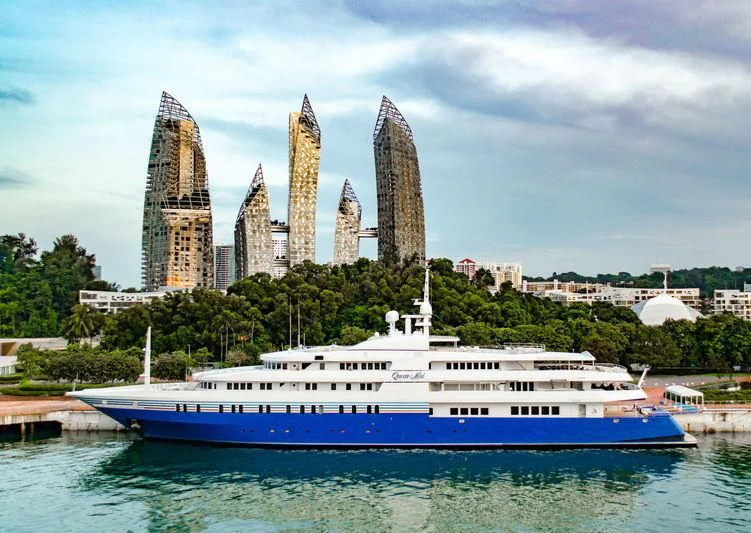 a large boat in the water aboard QUEEN MIRI Yacht for Sale