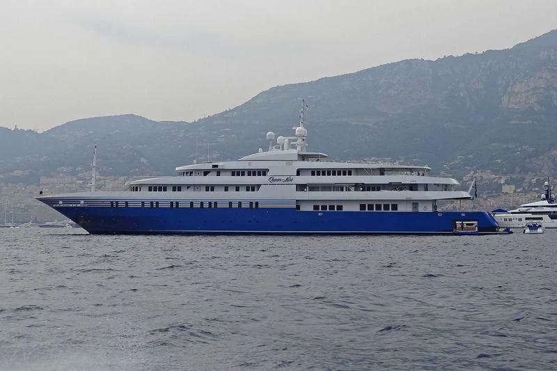 a large blue and white boat in the water aboard QUEEN MIRI Yacht for Sale