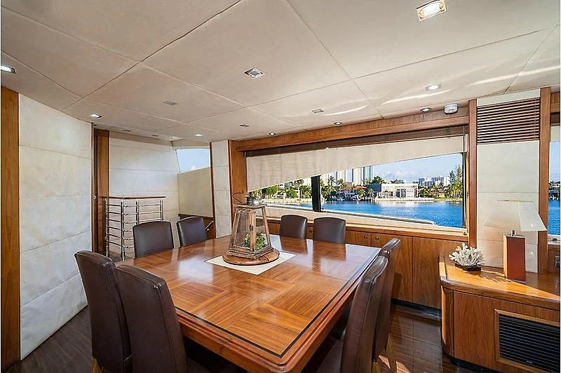 a room with a table and chairs aboard BEYOND Yacht for Sale