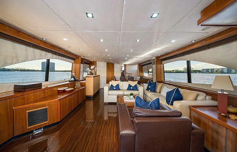a large living room with a large window aboard BEYOND Yacht for Sale