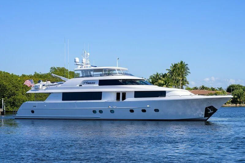 a white yacht on the water aboard DETERMINATION Yacht for Sale