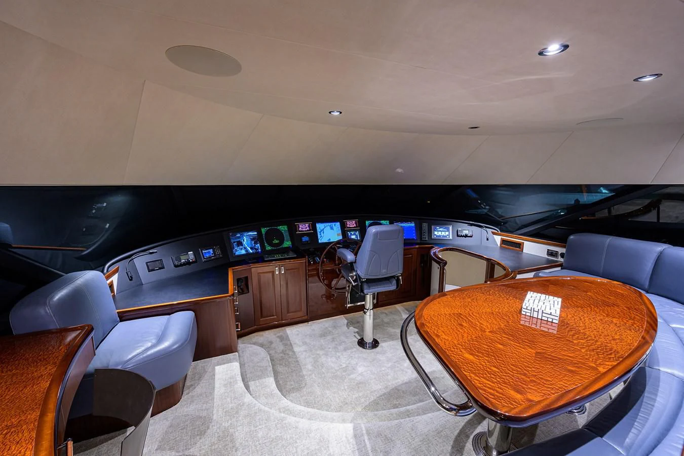 a room with a table and chairs aboard DETERMINATION Yacht for Sale