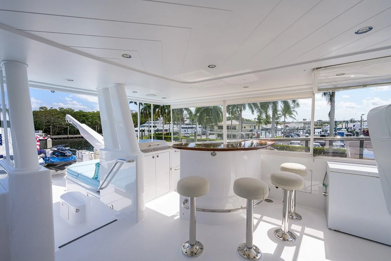 a room with a couple of chairs and a table with chairs aboard DETERMINATION Yacht for Sale