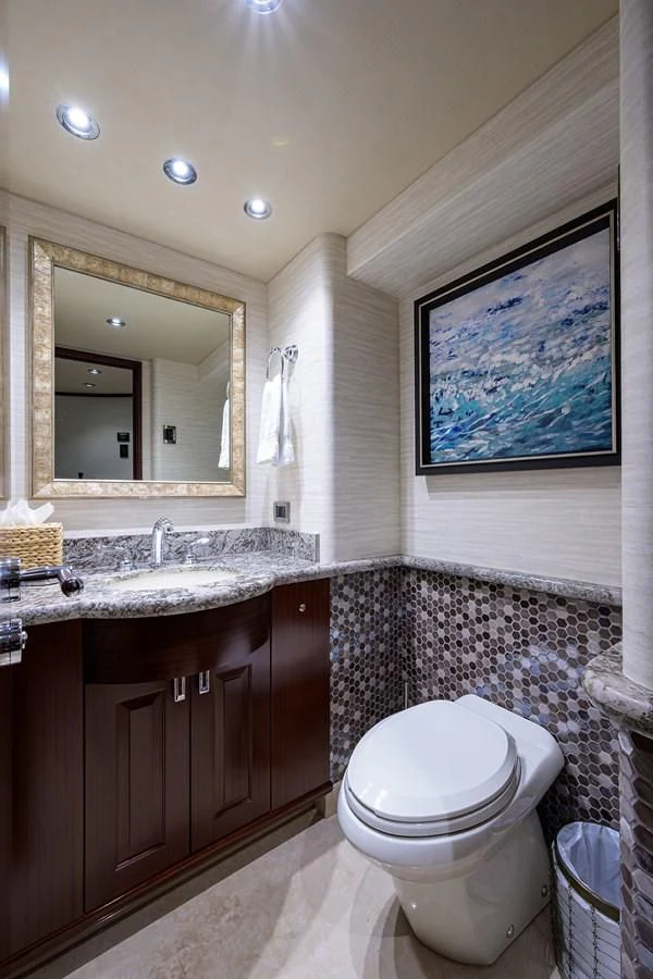 a bathroom with a sink and a toilet aboard DETERMINATION Yacht for Sale