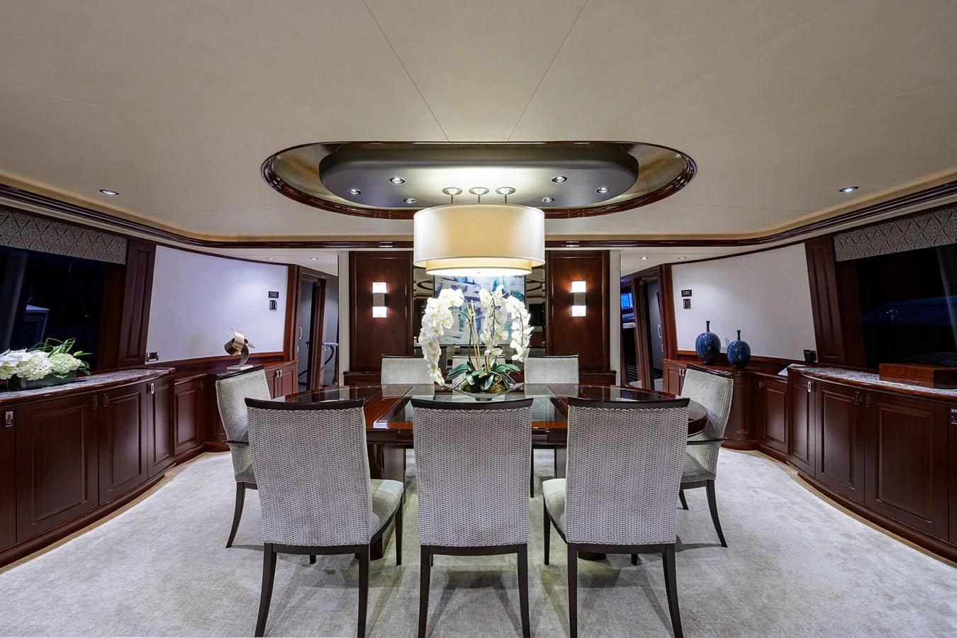 a large room with a table and chairs aboard DETERMINATION Yacht for Sale