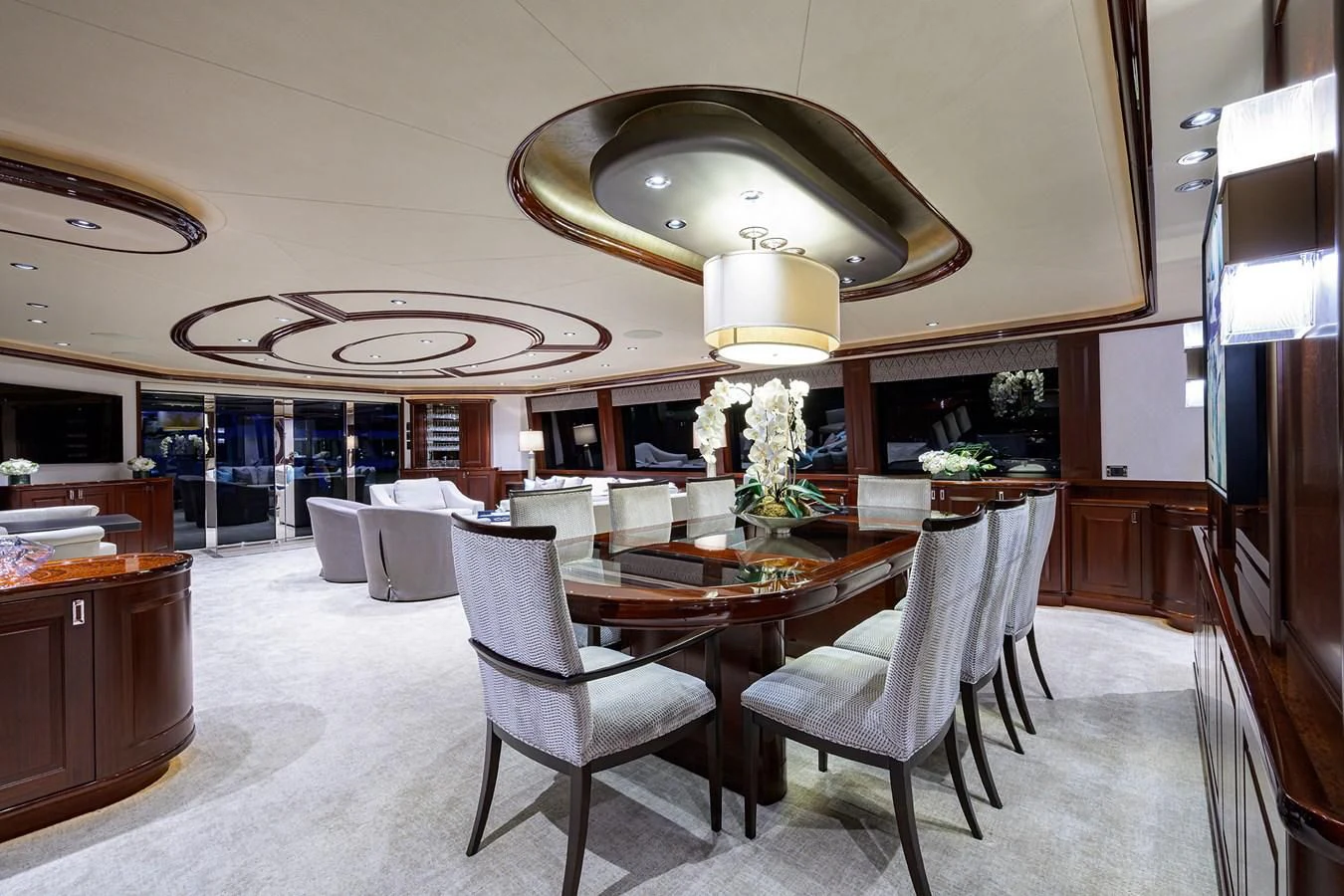 a large kitchen with a table and chairs aboard DETERMINATION Yacht for Sale